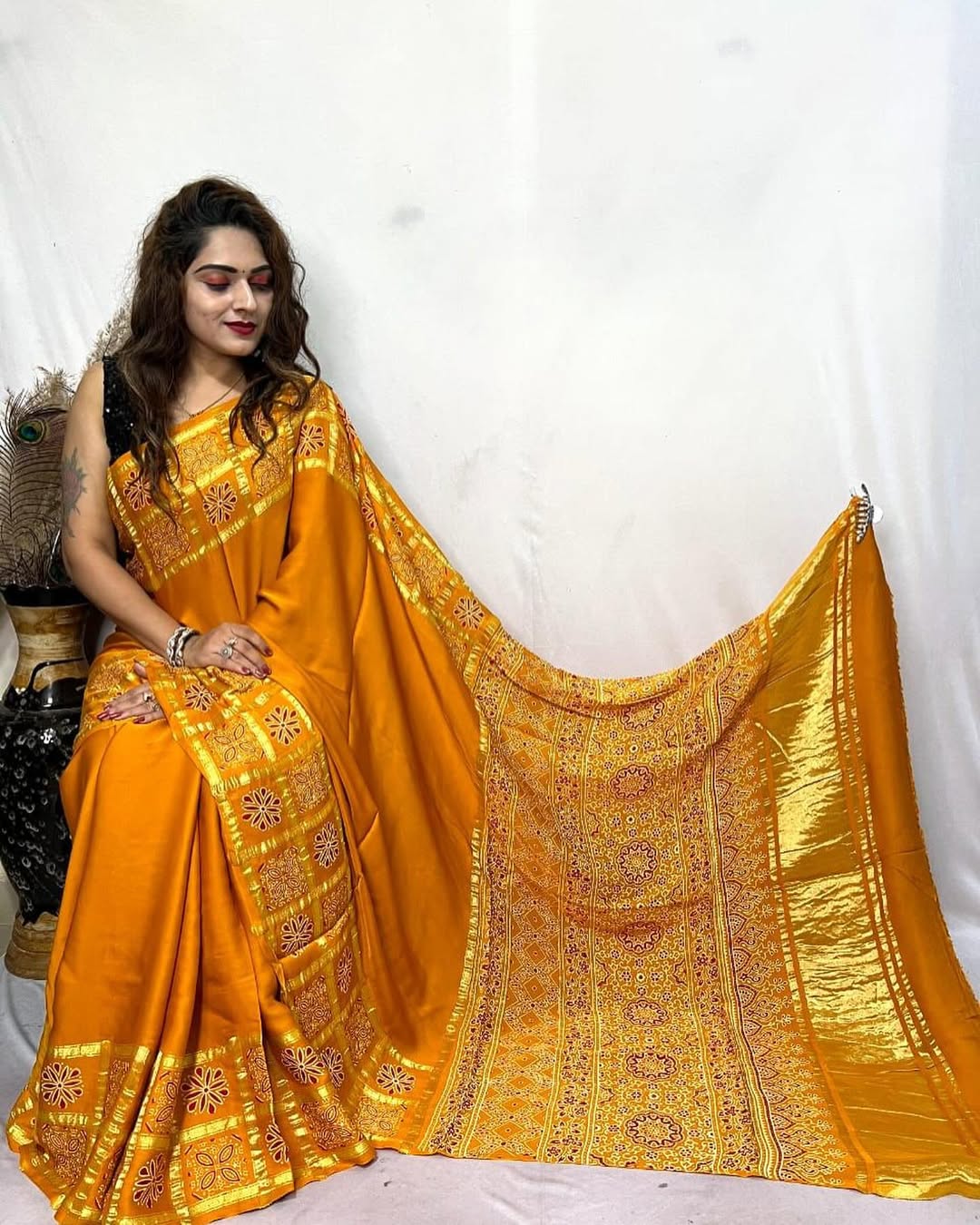 Musterd Hand Block Ajrakh Saree in Pure Modal Silk with Gharchola Border and Zari Detailing