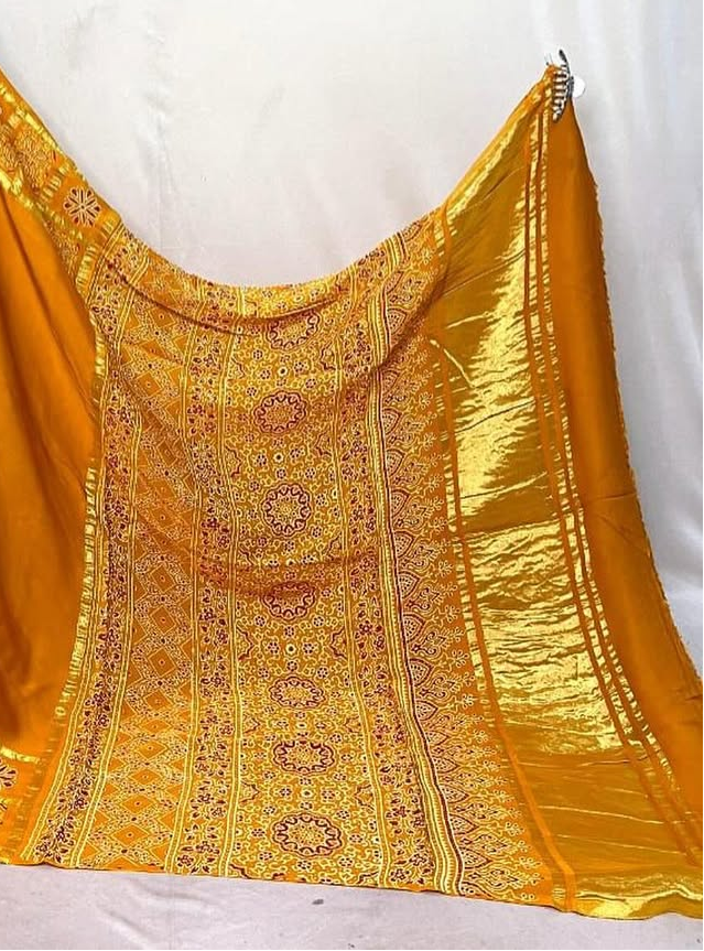 Musterd Hand Block Ajrakh Saree in Pure Modal Silk with Gharchola Border and Zari Detailing