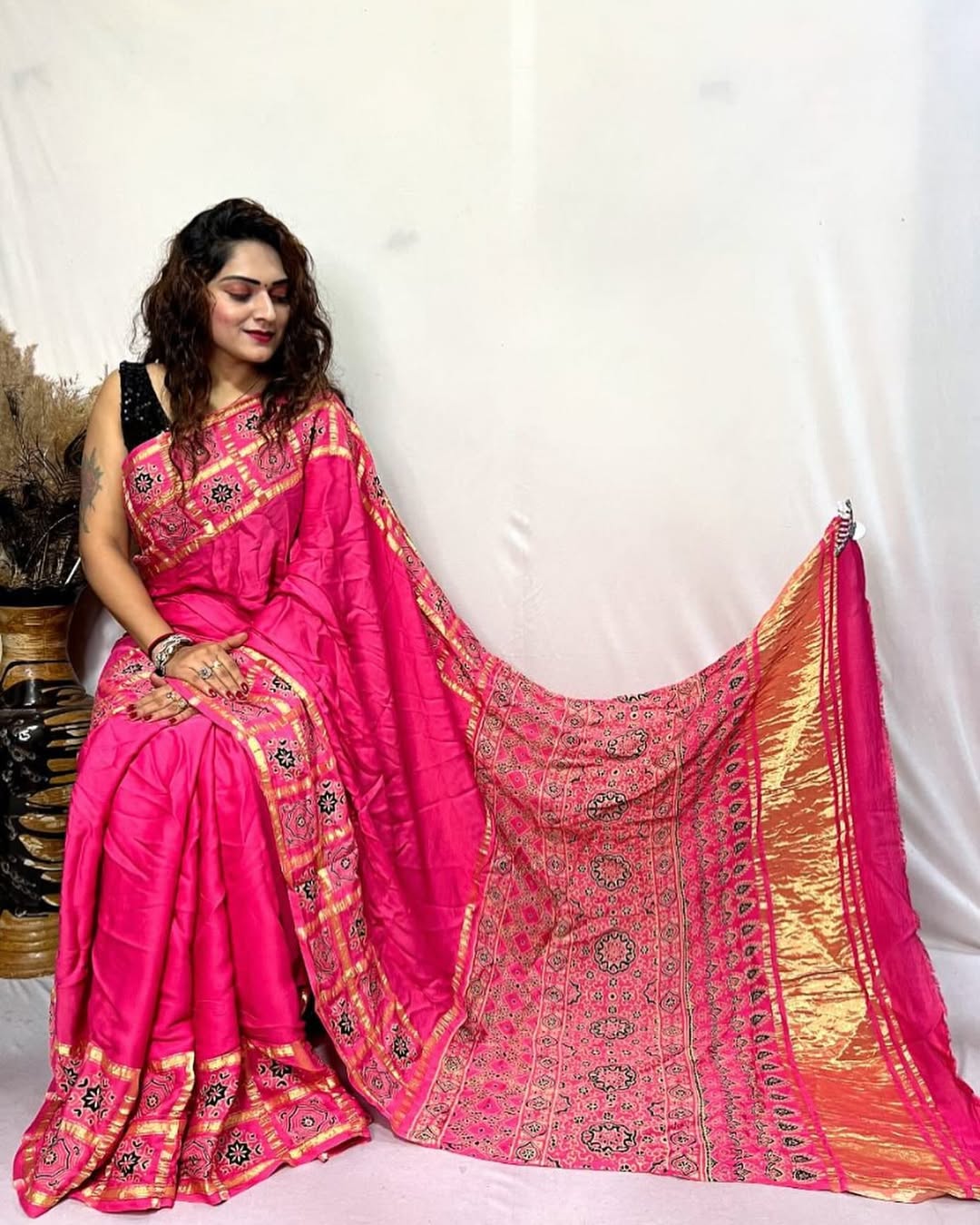 Pink Hand Block Ajrakh Saree in Pure Modal Silk with Gharchola Border and Zari Detailing