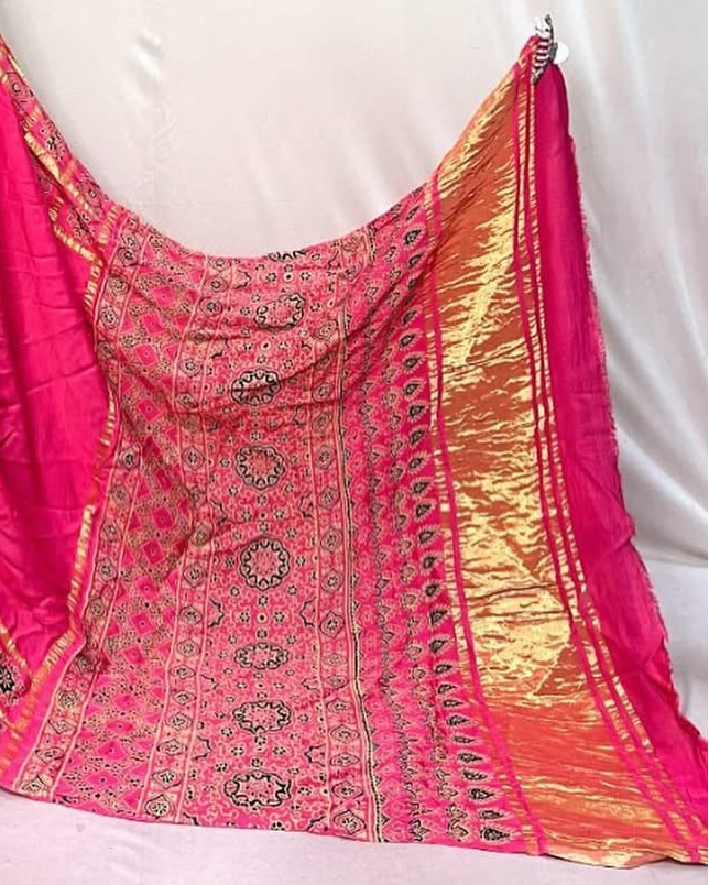 Pink Hand Block Ajrakh Saree in Pure Modal Silk with Gharchola Border and Zari Detailing