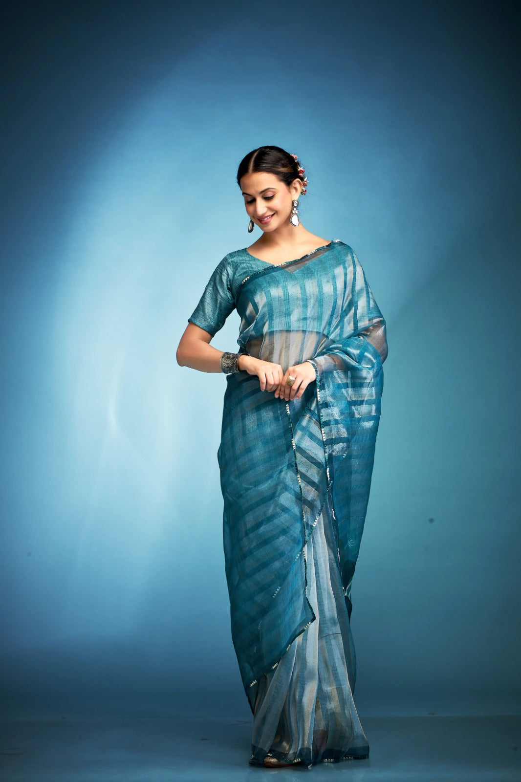 Lavish Aqua Blue Printed Tissue Saree