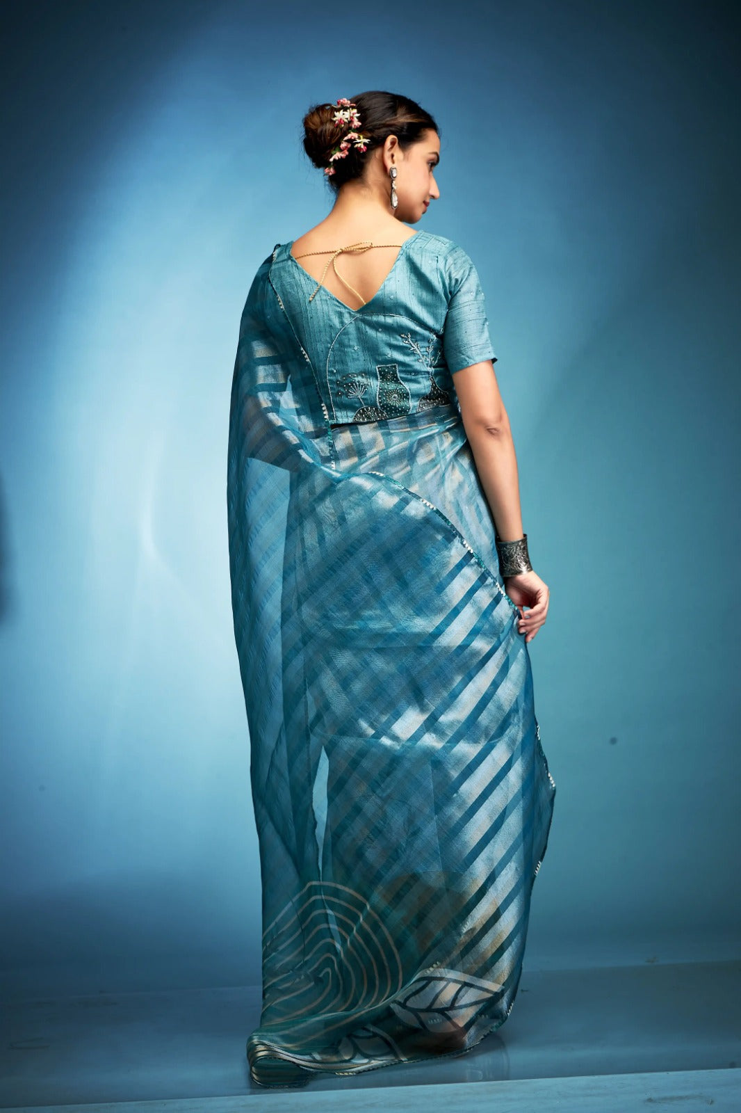 Lavish Aqua Blue Printed Tissue Saree